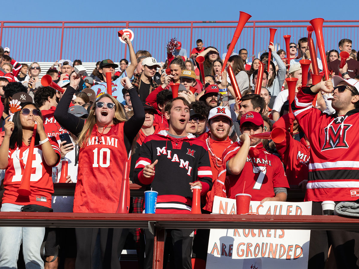 Fans cheer during the Homecoming football game